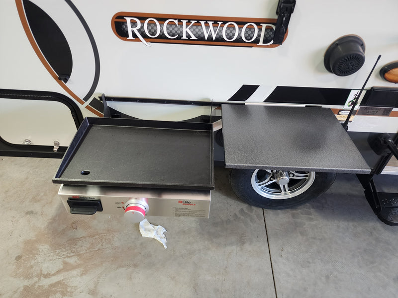 Rockwood RV rental: Outdoor cooking setup featuring a Suburban griddle and side table next to the travel trailer. — photo 2