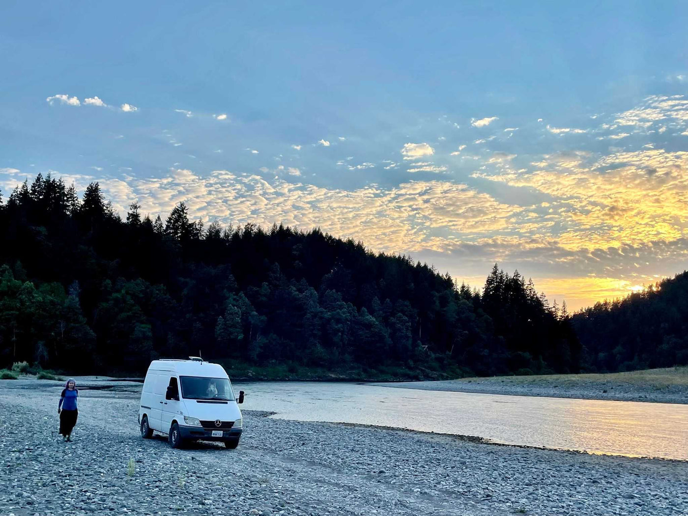  a man and his dog gaze at a serene ocean sunset.|RV rental: Bamboo kitchen counter — photo 2