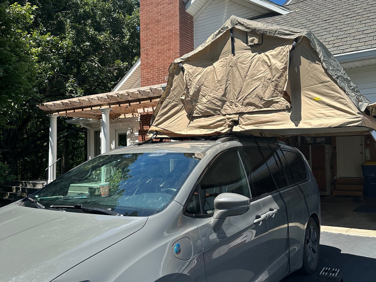  ready for an RV rental adventure.|A grey minivan with a Smittybilt rooftop tent — photo 3