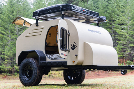 Explore with this rugged Oregon Trail'R teardrop camper rv rental, complete with a rooftop tent for off-road adventures.