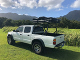 White Tacoma pickup with Tuff Stuff rooftop tent. Perfect rv rental for mountain adventures.