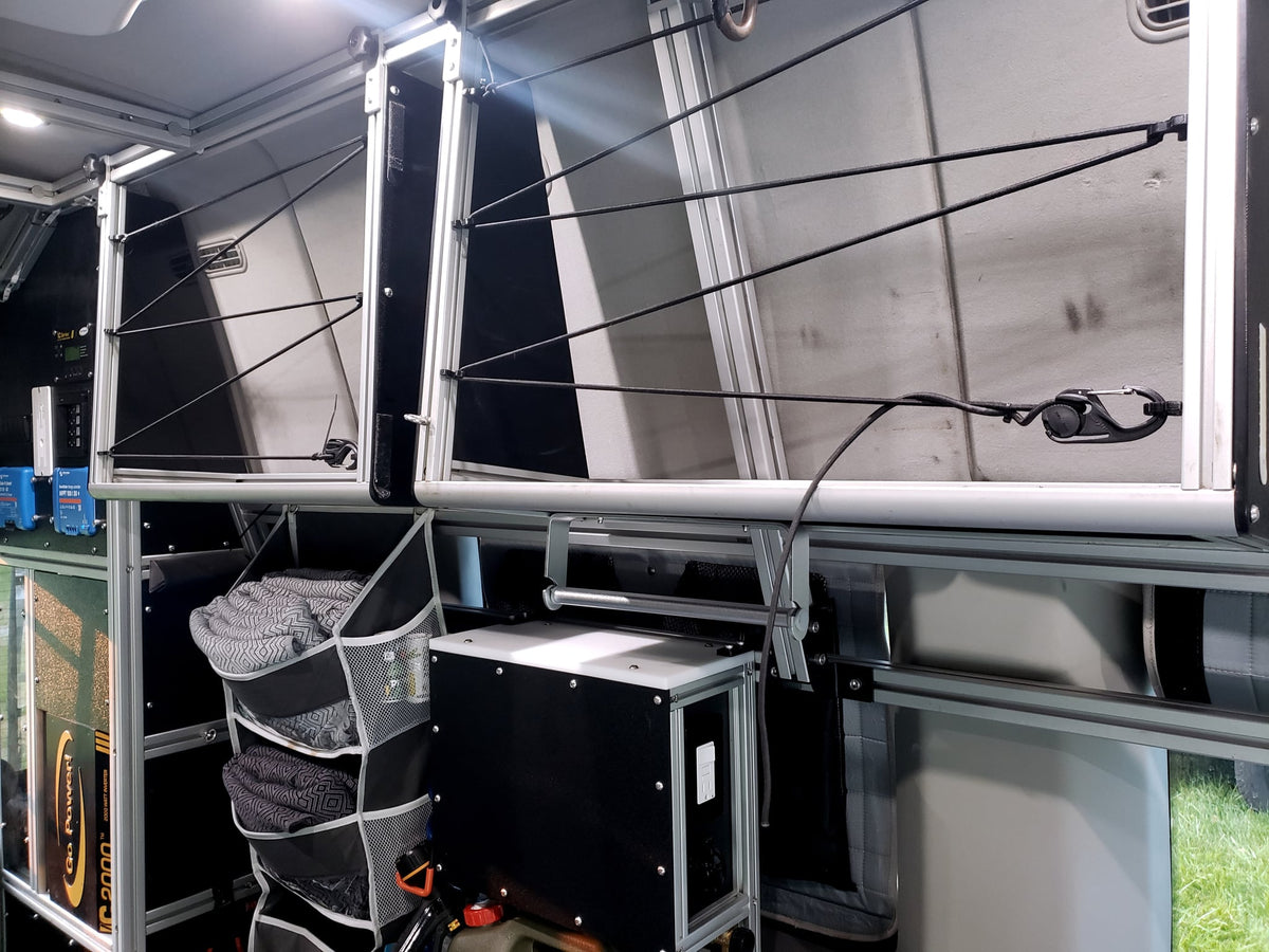  and modular seating.|RV rental interior: black seats with seatbelts — photo 19