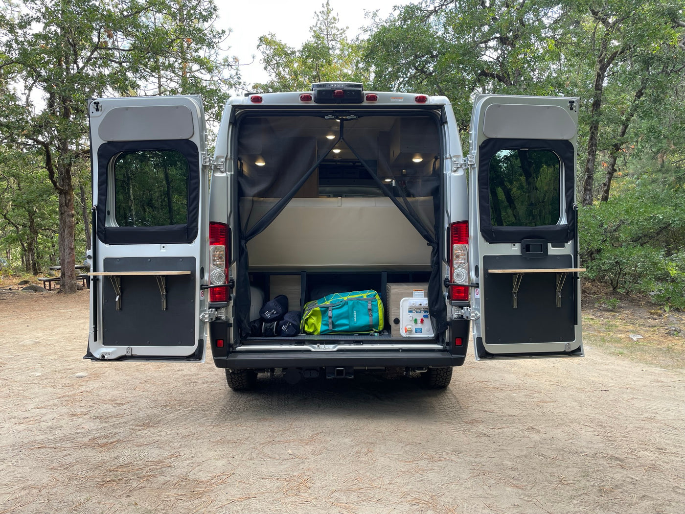  plus a small kitchen sink. Ideal for travel.|Plush sofa and scenic views from inside this spacious RV rental — photo 7