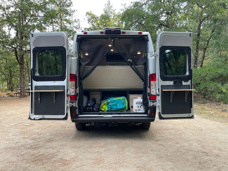  plus a small kitchen sink. Ideal for travel.|Plush sofa and scenic views from inside this spacious RV rental — photo 7