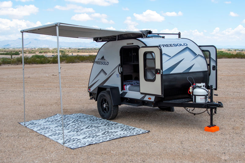  and AC. Compact camper interior layout.|RV rental: Compact kitchen with stove — photo 8