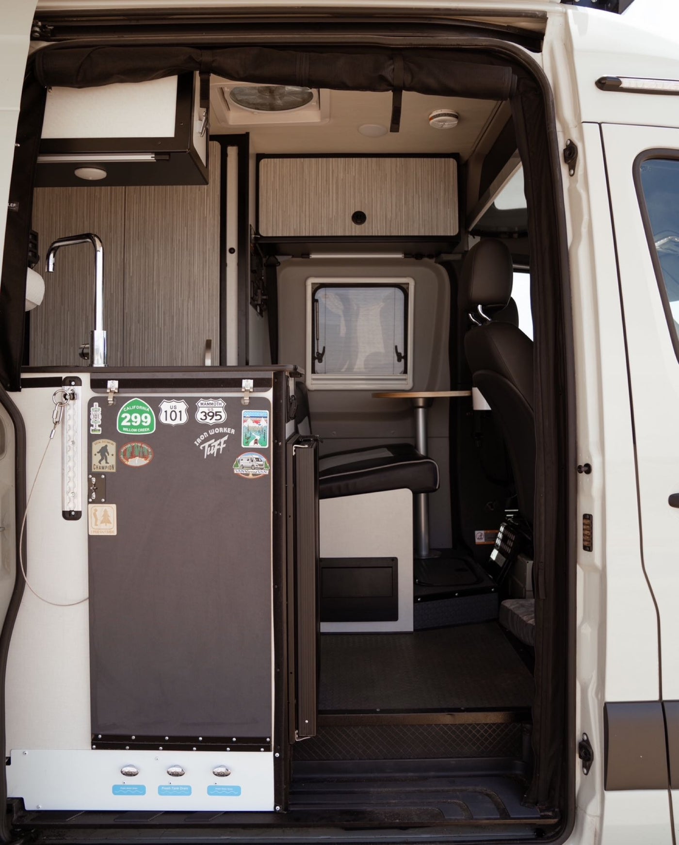  perfect for relaxation and travel.|This cozy rv rental is pet-friendly! Woman reads in the upper bunk — photo 3