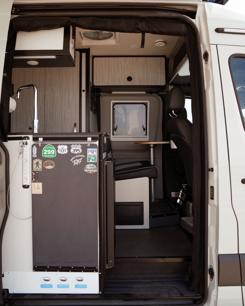  perfect for relaxation and travel.|This cozy rv rental is pet-friendly! Woman reads in the upper bunk — photo 3