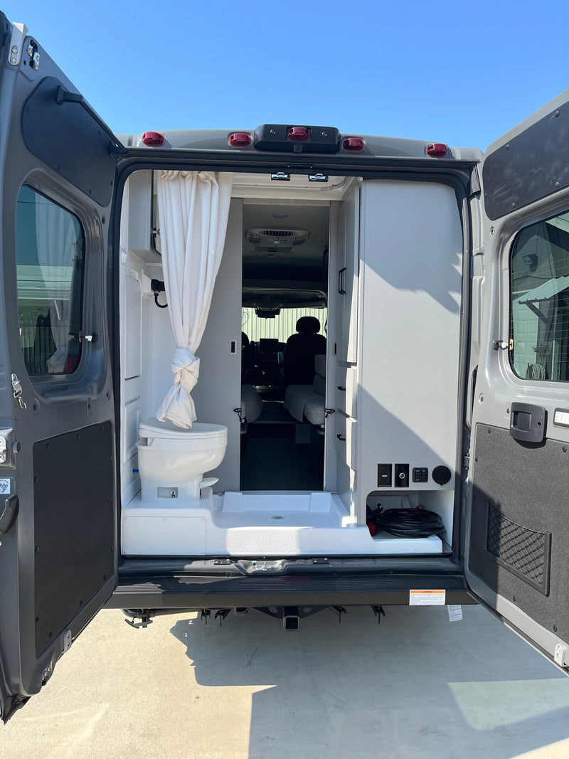  and rear doors. Compact travel ready.|Inside an RV rental: a modern compact kitchen with a sink — photo 10