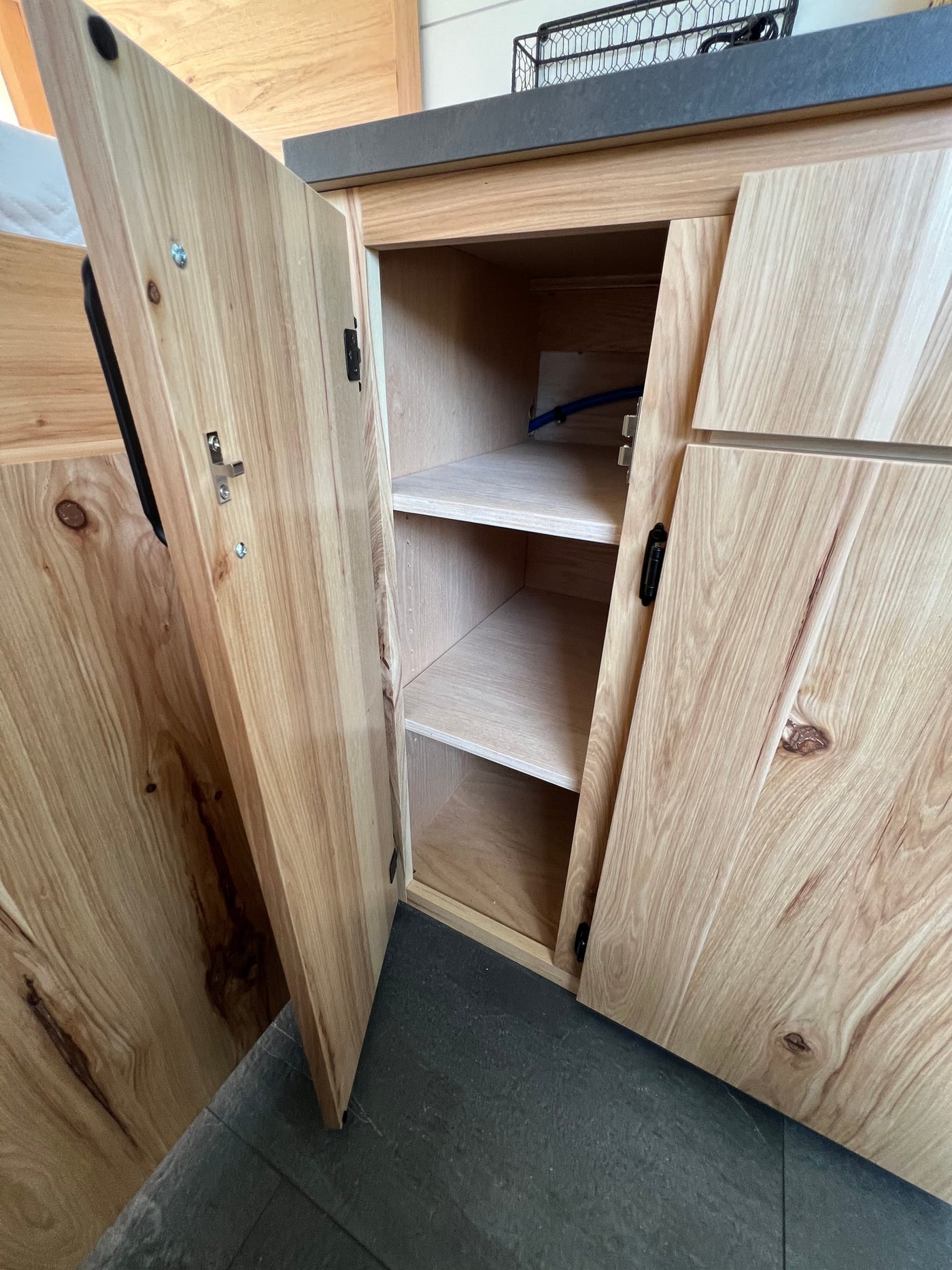  & comfy black leather captain's chairs. Ready for adventure.|RV rental interior showcases a modern design with bunk beds — photo 10