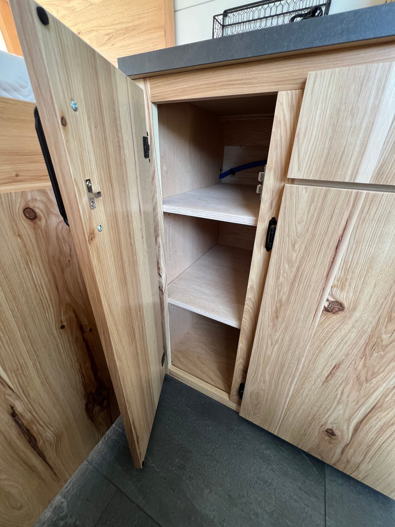  & comfy black leather captain's chairs. Ready for adventure.|RV rental interior showcases a modern design with bunk beds — photo 10