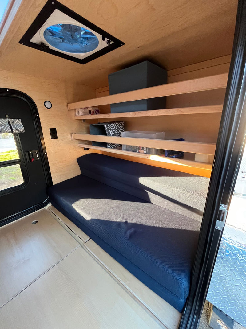  and an entry door.|Night camping with a cozy RV rental teardrop trailer — photo 8