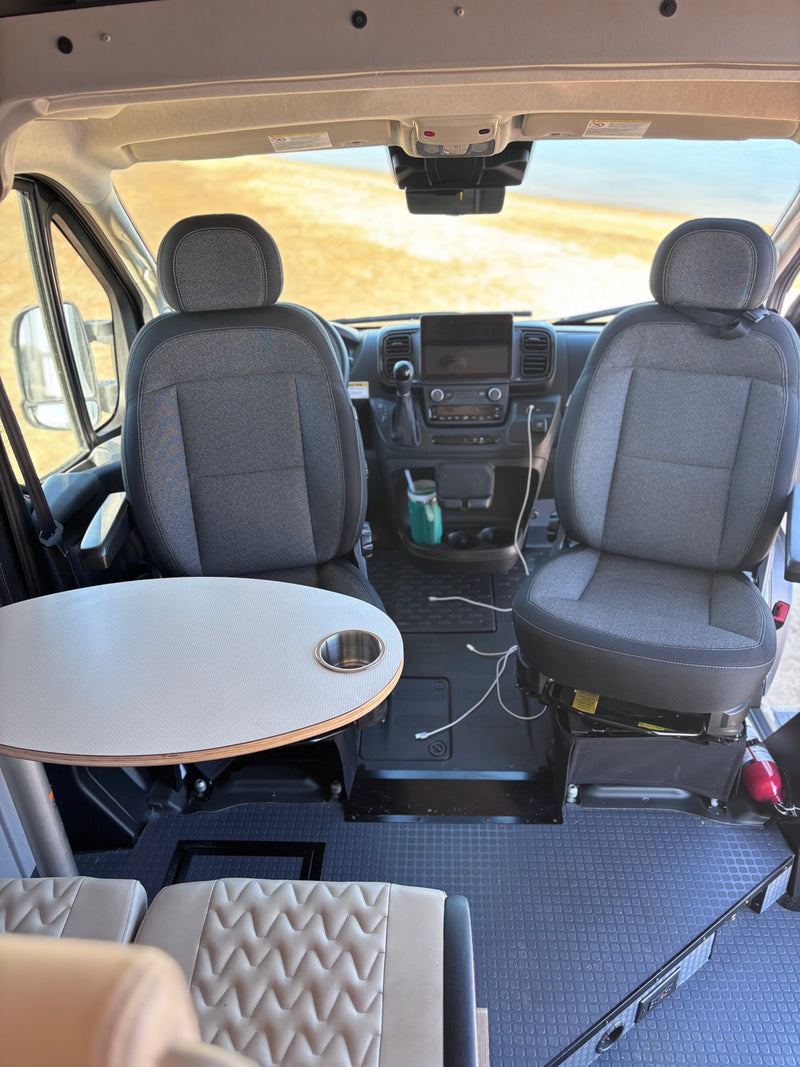 Spacious RV rental: front swivel seats, dashboard, and a built-in table. Perfect for road trip adventures. — photo 19