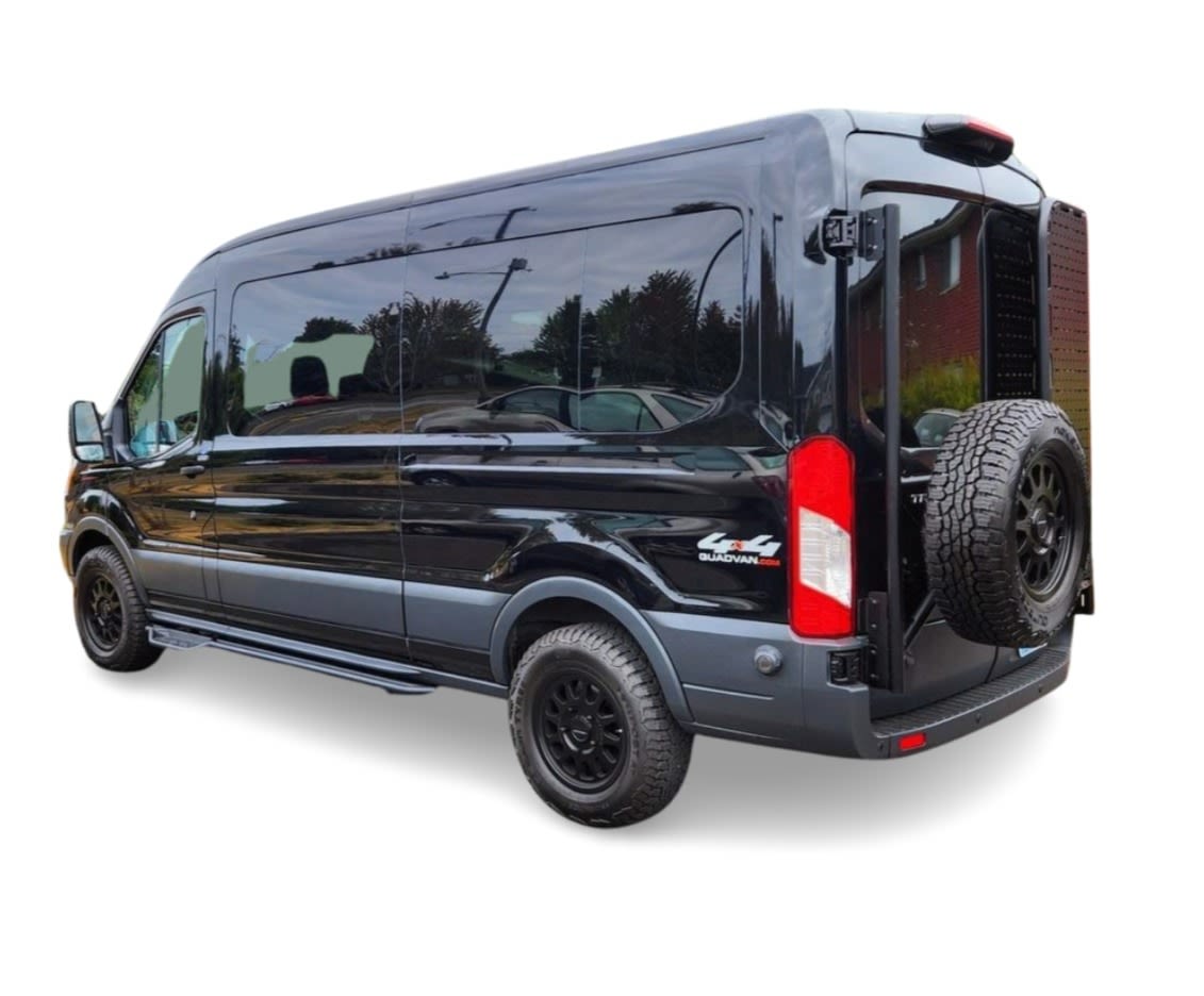 Black 4x4 Ford Transit van with off-road tires & rear spare, perfect for your RV rental adventure. — photo 6