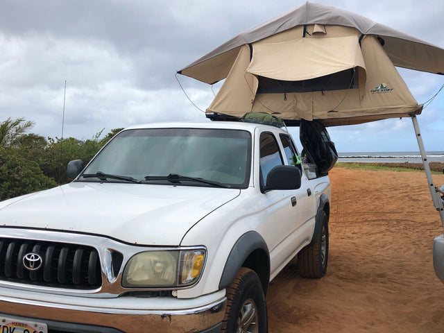  waves visible.|Relaxing beach sunset with an outdoor kitchen setup and chairs. Perfect for an RV rental escape!|Beach day setup: colorful chairs
