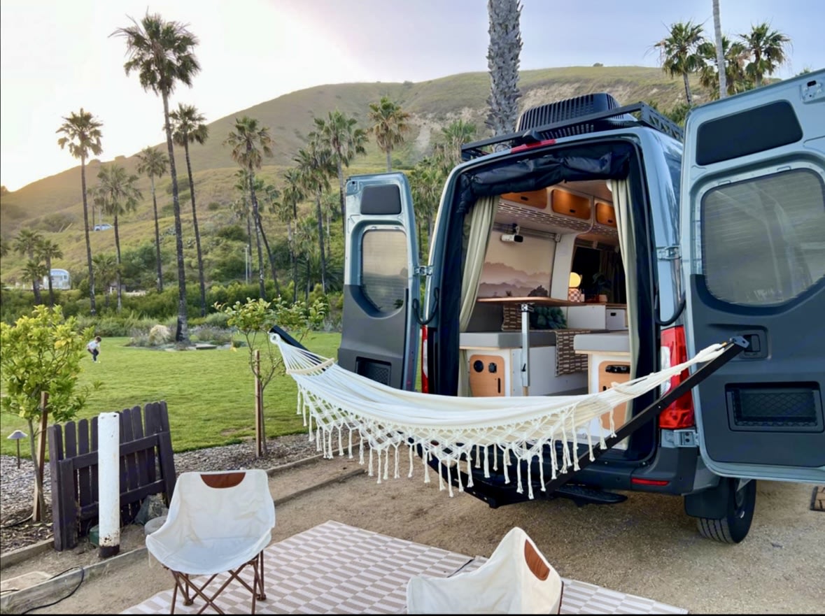Scenic **rv rental** camper van with open doors