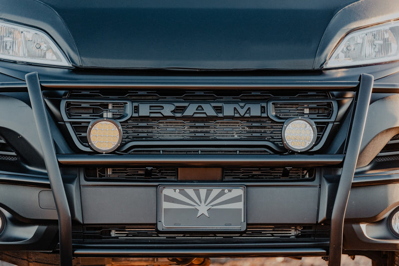 Front of a black Ram RV rental with off-road lights, bull bar, and an Arizona flag license plate. — photo 13