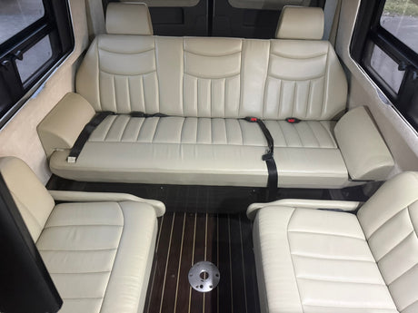  and large windows ready for travel.|Interior of an rv rental with a kitchenette