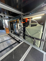 Custom RV rental interior features modular storage, an efficient water pump system with tank, and a pull-out platform.
