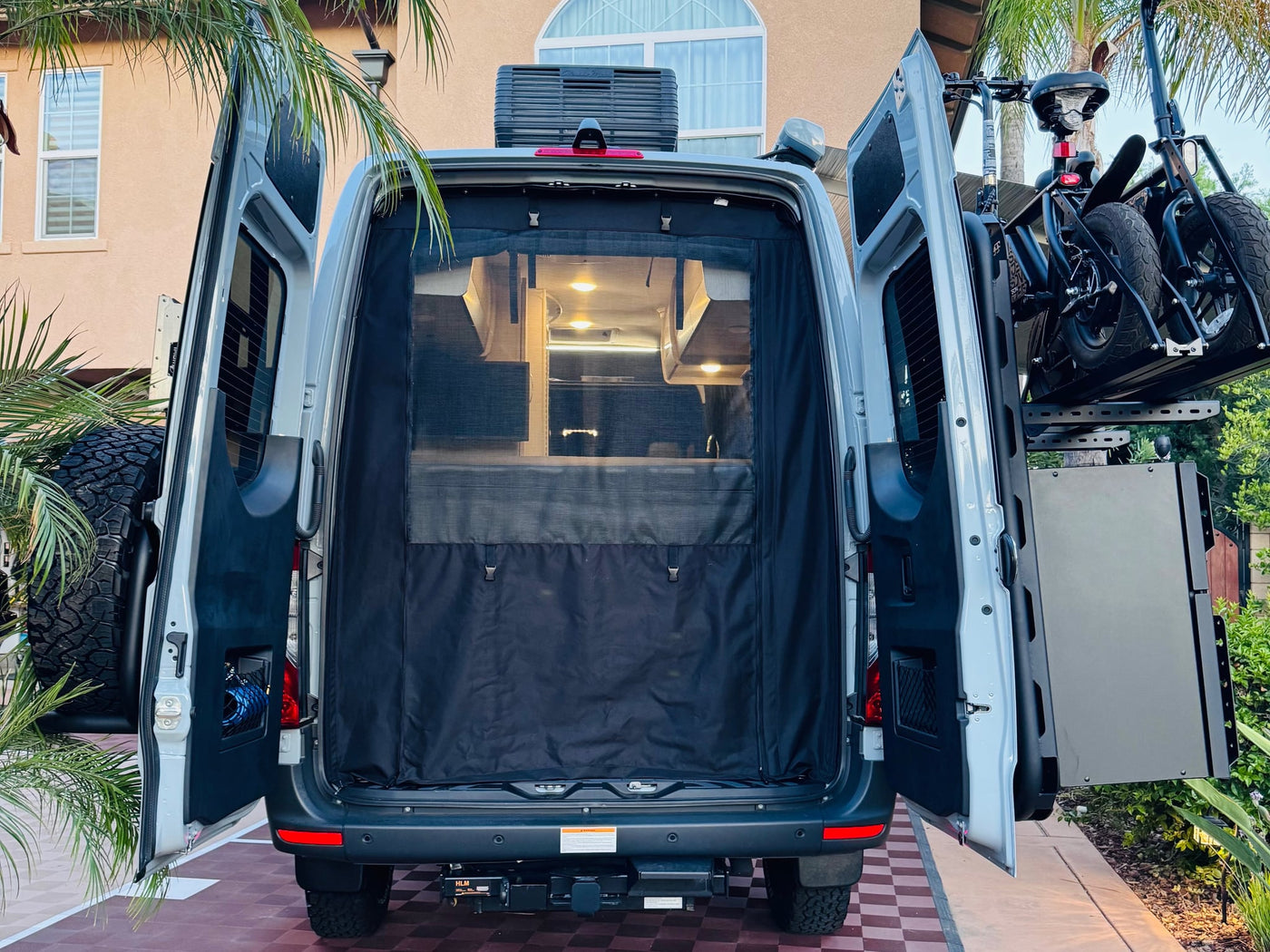  and utility panels on the rear for adventure gear.|Discover this light grey Tranquility camper van rv rental — photo 16
