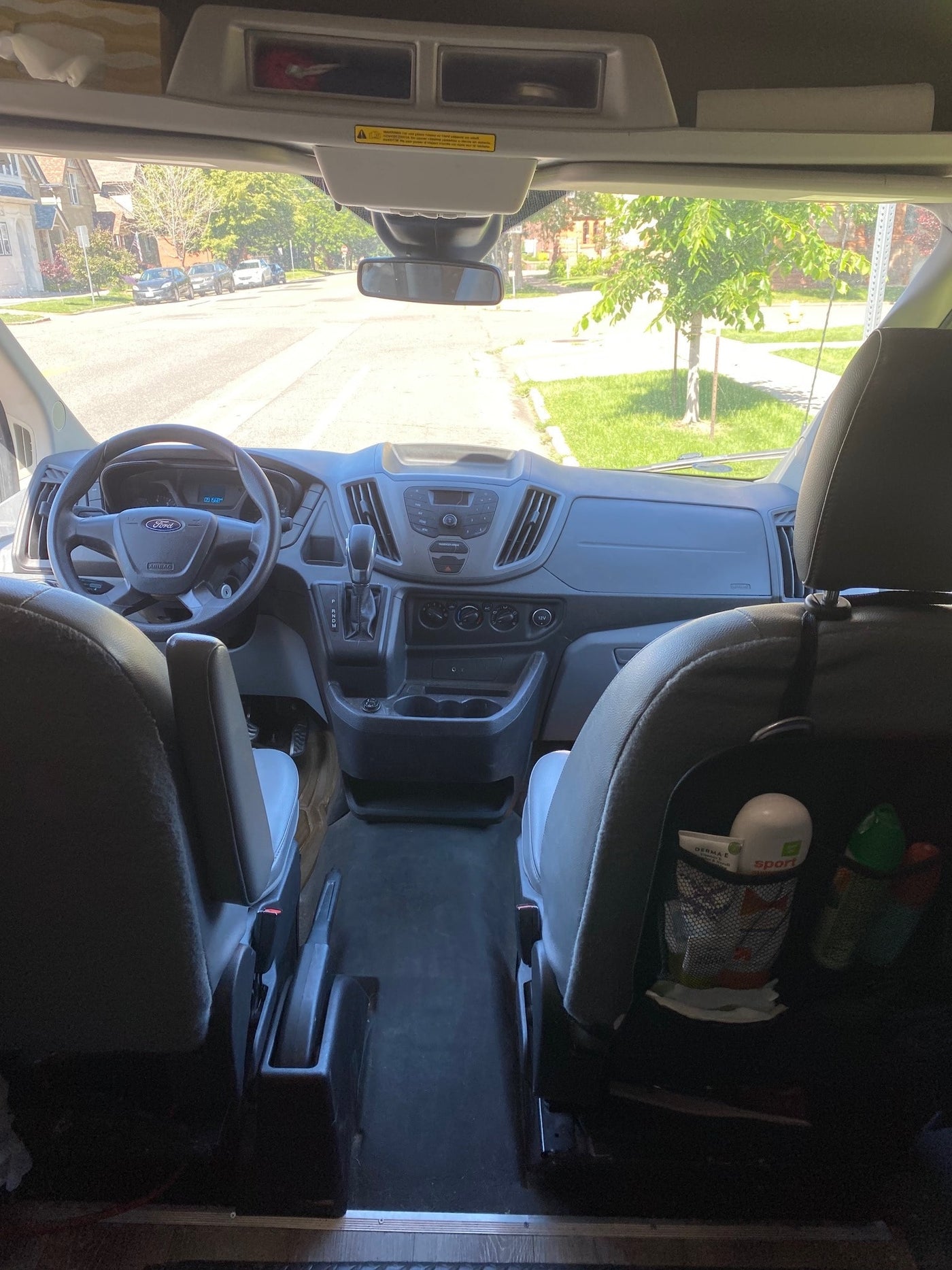  and a central table.|Inside an RV rental van: a comfy bed — photo 7