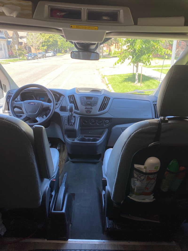  and a central table.|Inside an RV rental van: a comfy bed — photo 7