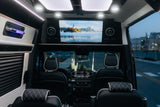 Luxurious RV rental interior: spacious cabin with comfortable seating, ambient lighting, and large entertainment screen for premium travel.