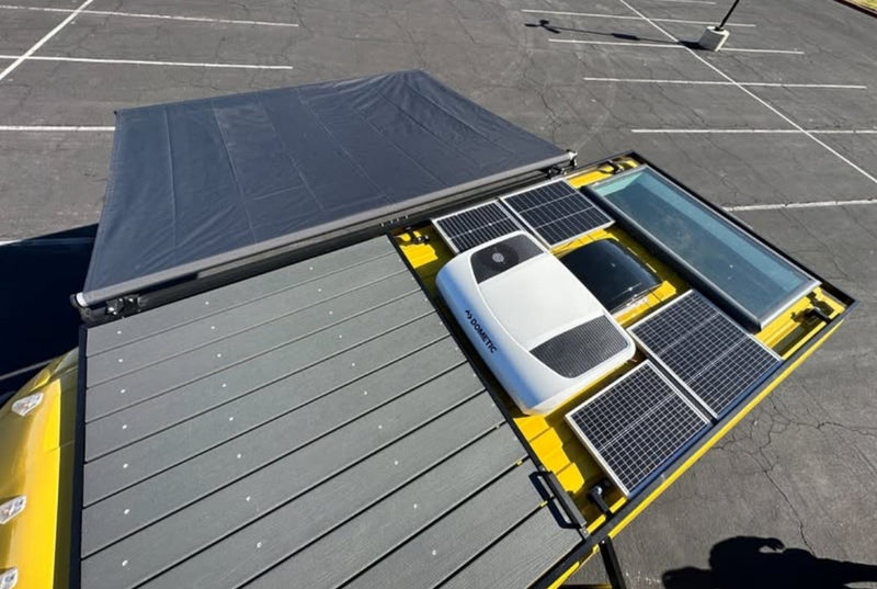 RV rental: Top view of the roof showing solar panels, Dometic AC, a skylight, and an extended awning. Ready for adventure! — photo 3