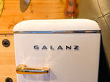 Stylish GALANZ retro mini-fridge with gold handle and chrome trim, ideal for an RV rental compact kitchen.