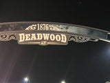 Approaching Deadwood, SD under a night sky. The 1876 welcome sign beckons. Perfect for an RV rental trip back in time!