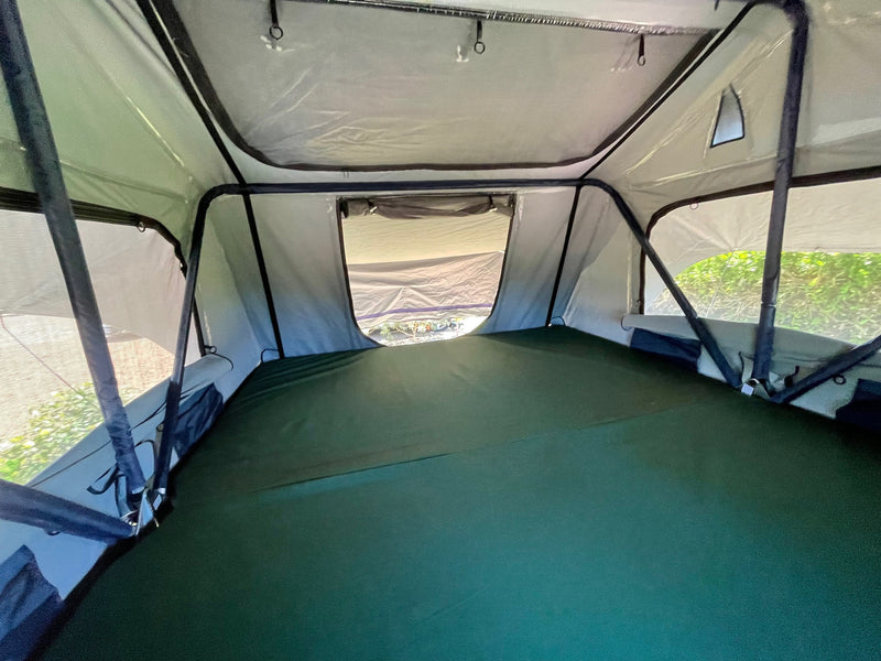  and dive equipment set up outdoors.|Gray Jeep with rooftop tent deployed — photo 8