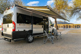 Lakeside ETHOS camper van rv rental with extended awning and outdoor seating, perfect for serene travel and leisure.