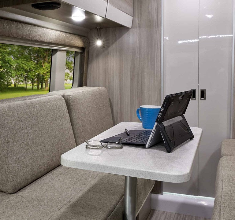  and shower. Ideal for campervan trips.|Rear of black Thor Sequence RV rental with two Wing e-bikes on a rear bike rack — photo 11