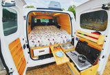 Step into this cozy rv rental campervan! Featuring a comfortable bed, compact kitchen, & fridge for your next adventure.