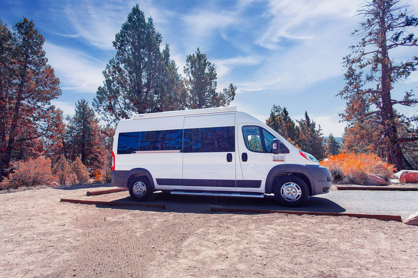  showing two camping chairs and a mat outside.|Cozy RV rental interior featuring a dinette — photo 8