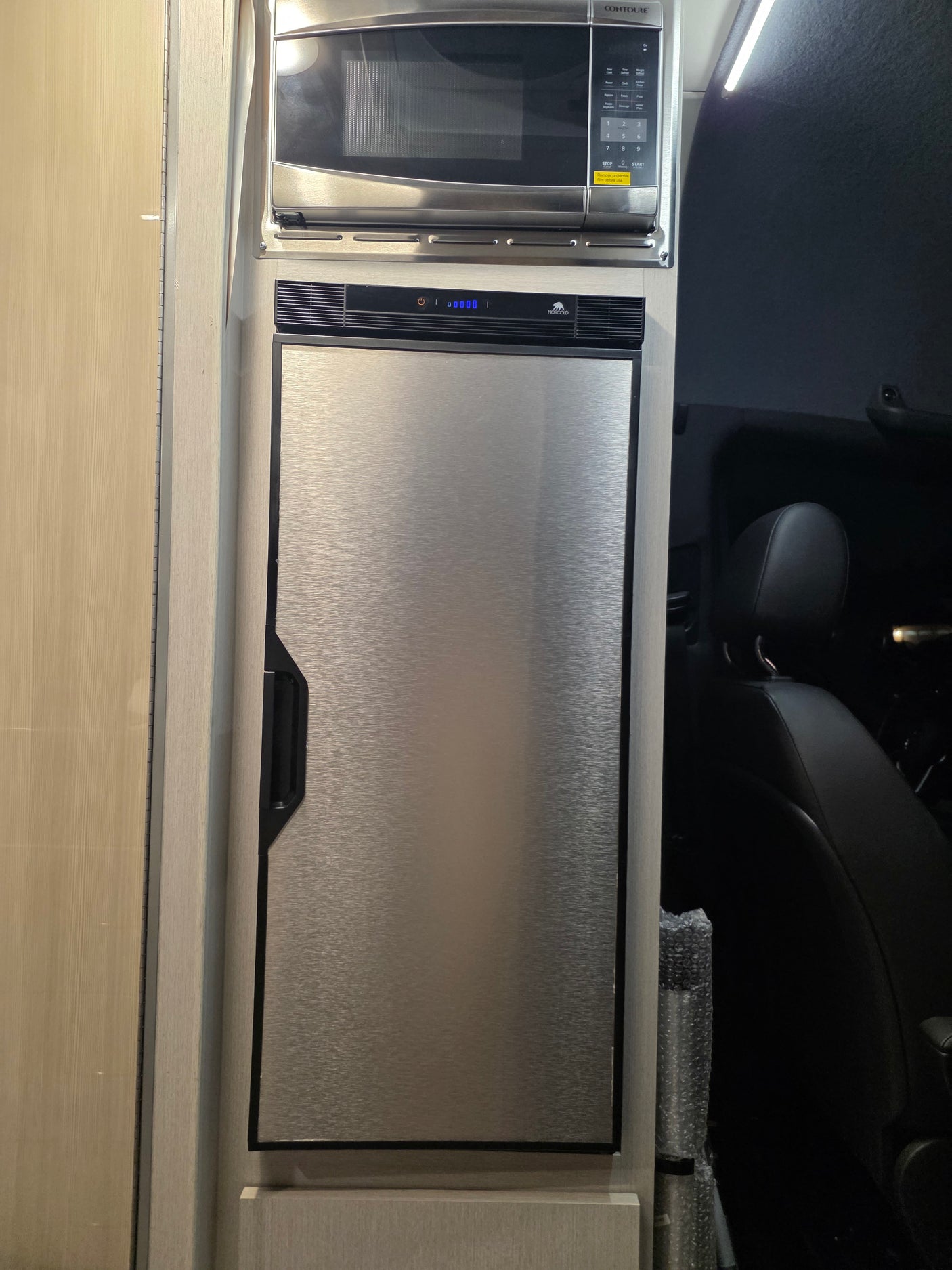 RV rental kitchen with CONTOURE microwave & NORCOLD fridge, new and ready for use (remove film!).