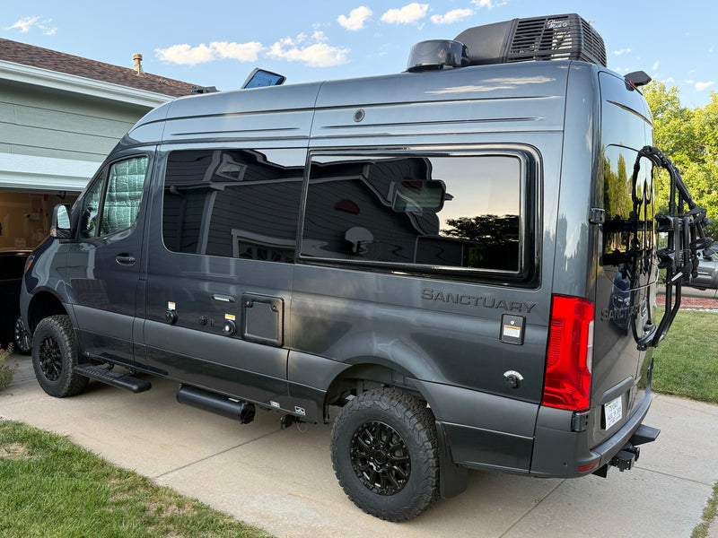 Gray Sanctuary rv rental camper van, a Mercedes-Benz Sprinter conversion, with bike rack & utility hookups. — photo 13