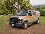 Two friends enjoy their Hawaii road trip in a rented camper van. This fun RV rental is perfect for a tropical island adventure!