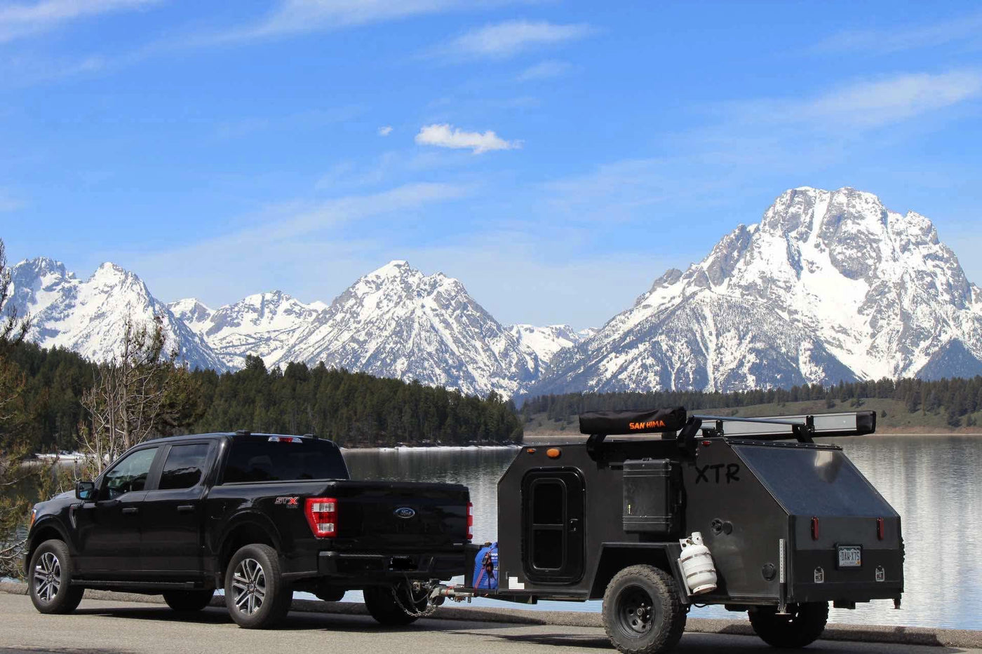  and power outlets. Ideal for travel.|Inside a compact RV rental's cozy sleeping area — photo 1