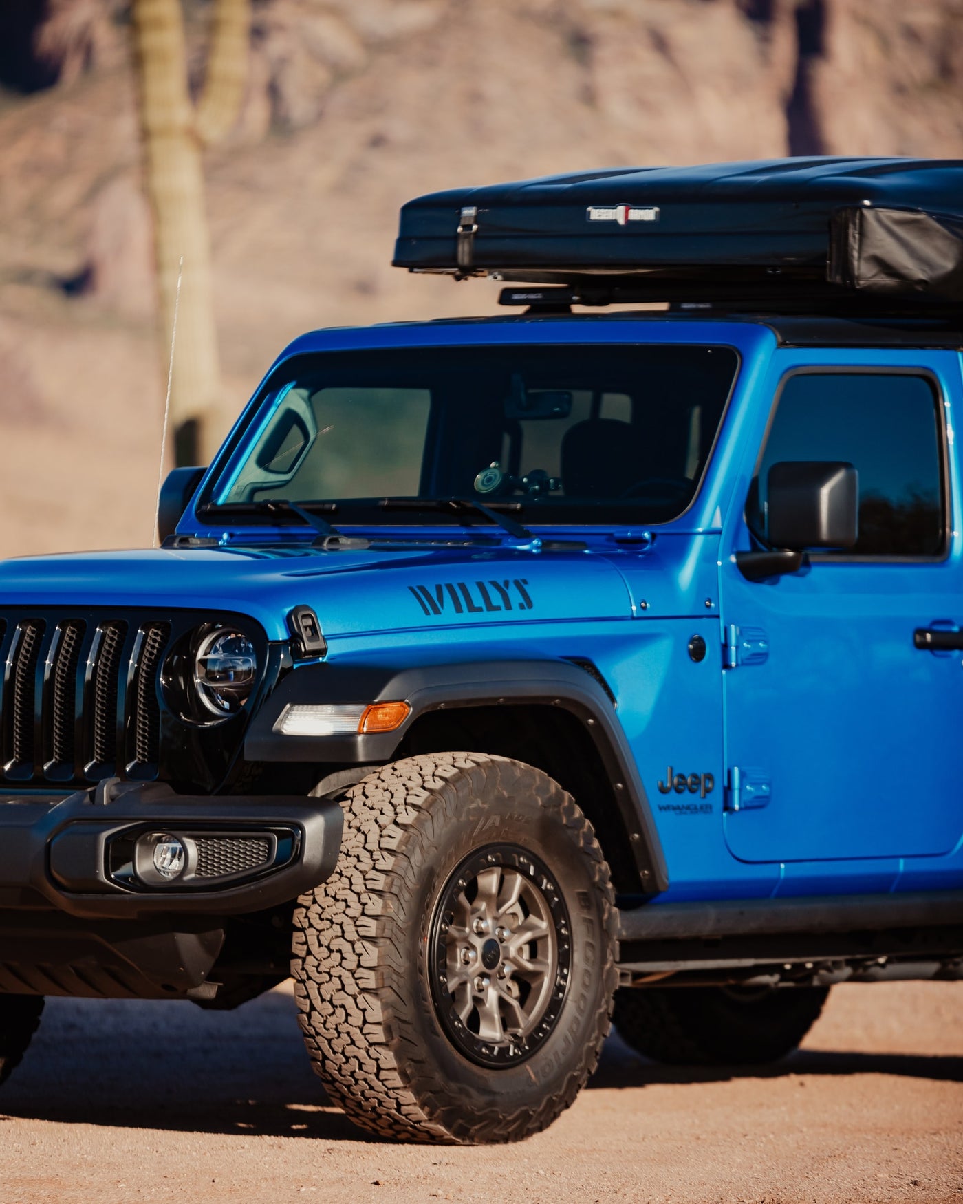 Bright blue Jeep Willys with black rooftop tent for scenic off-road RV rental adventures. — photo 18