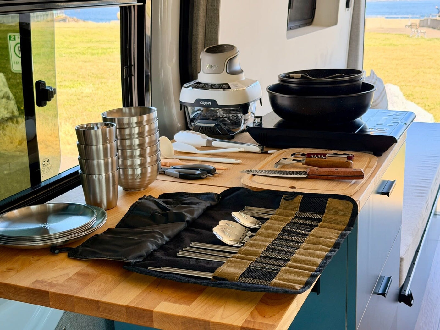  and comfortable bench.|Relax in this RV rental. Modern interior features a kitchenette with a toaster & coffee maker — photo 13
