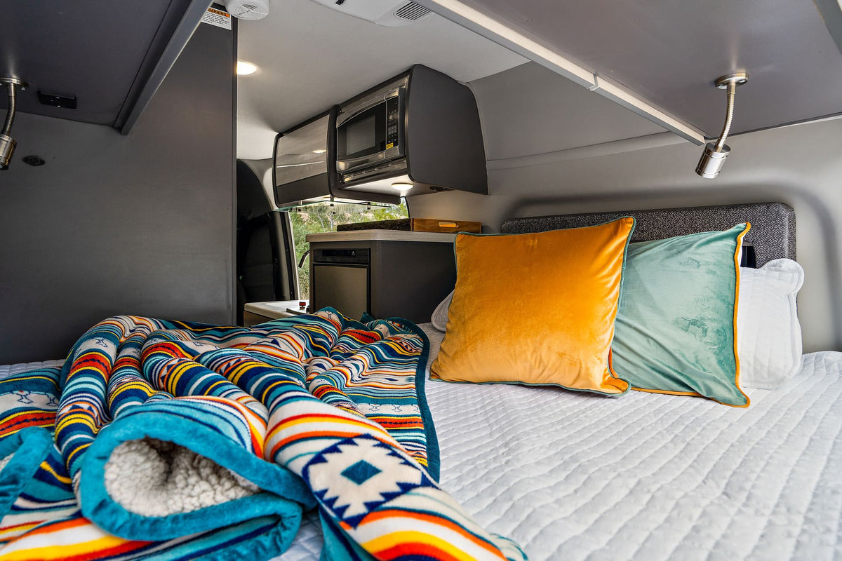 plus a cozy bed for comfortable travel.|Silver Sanctuary 4x4 Sprinter camper van with bikes — photo 8
