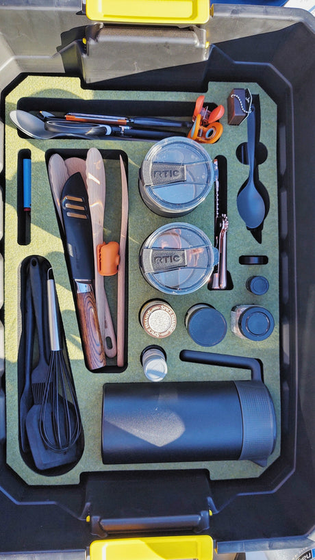 Organized RV rental kitchen gear: custom kit with cutlery, RTIC tumblers, wooden & silicone utensils, spices, & grinder.