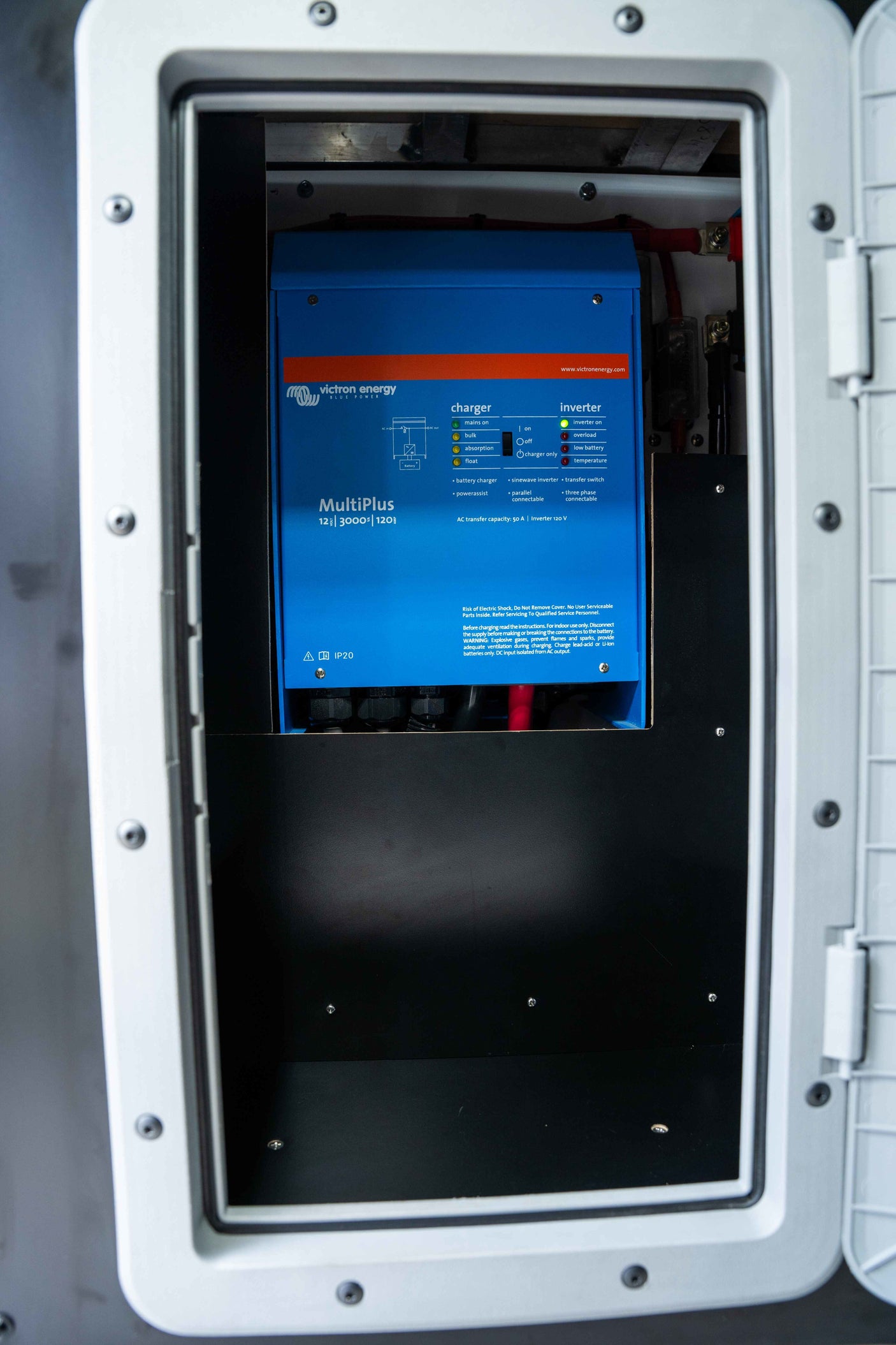 A Victron MultiPlus inverter/charger in an RV rental, showing power management details for a comfortable journey.