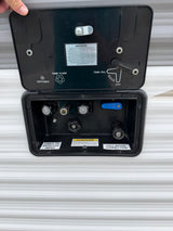 RV rental utility panel: connections for city water, tank fill/flush, winterization, and cable/satellite inputs.