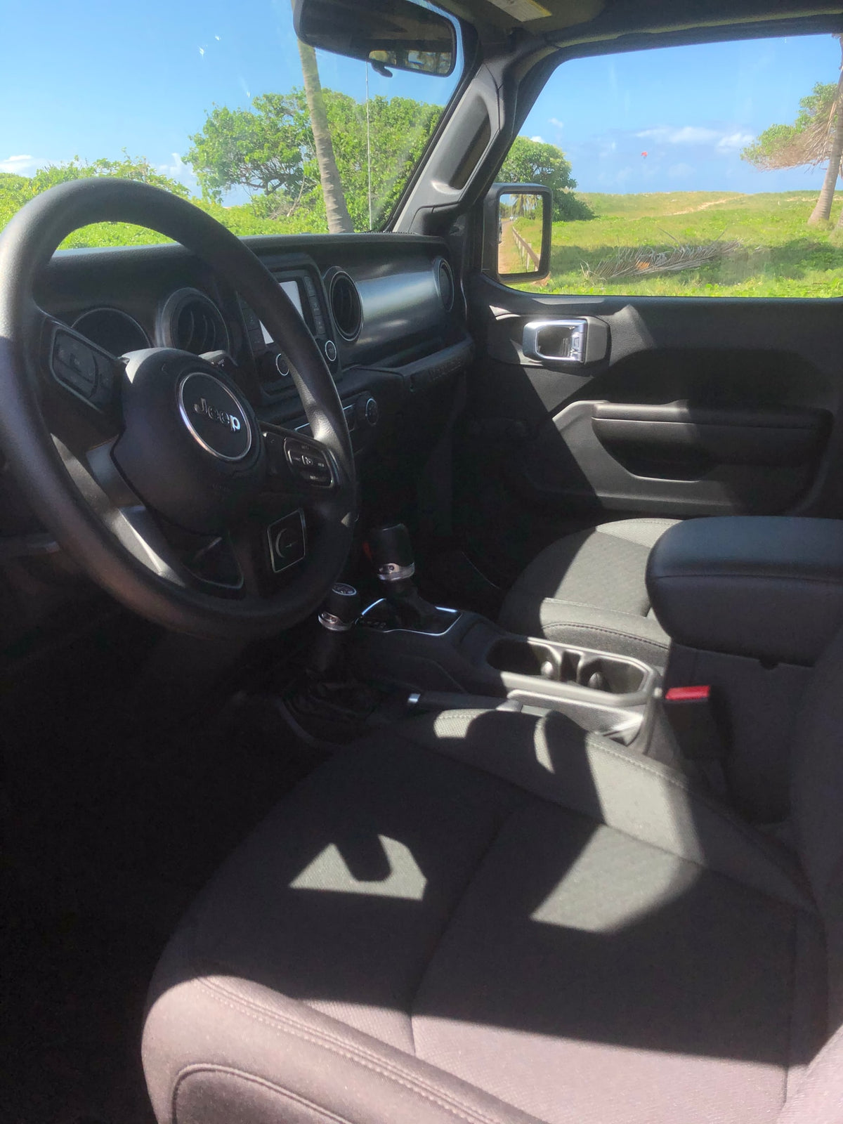 Sunny day view from a Jeep interior. Explore new horizons and enhance your RV rental adventure. — photo 10