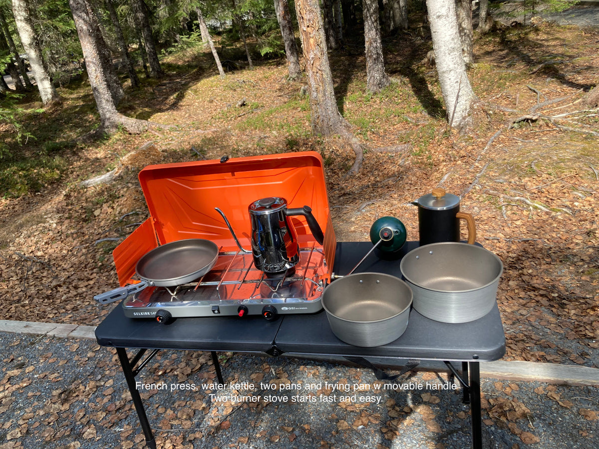 RV rental ready: Outdoor cooking setup with two-burner stove, French press, kettle & pans for delicious camp meals. — photo 12