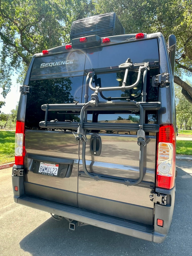  ready for adventure.|BFGoodrich All-Terrain KO2 tire and Raceline wheel on an RV rental. Perfect for rugged off-road camper van adventures.|A dark gray Thor Sequence camper van with off-road tires — photo 6