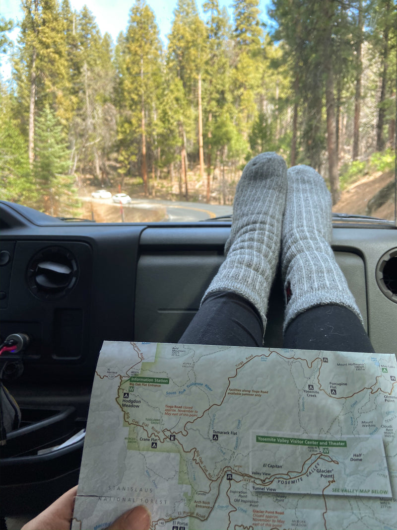 RV rental road trip: Feet up, map open, exploring Yosemite National Park's scenic roads. — photo 5