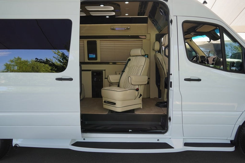  and a front-mounted TV. Ideal for comfortable group travel.|View of a modern RV rental's rear interior — photo 9