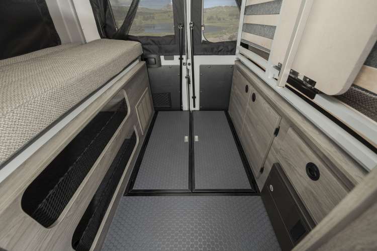  pop-top access.|Spacious RV rental interior showcasing a kitchenette — photo 5